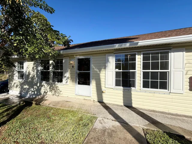 a view of a house with a door and a window