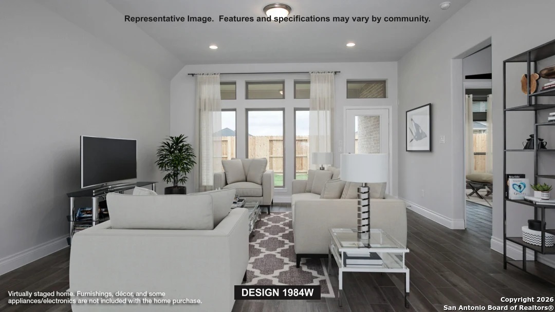 1727 Gyst Road Seguin, TX 78155 - Photo 4 of 7 a living room with furniture a flat screen tv and a fireplace