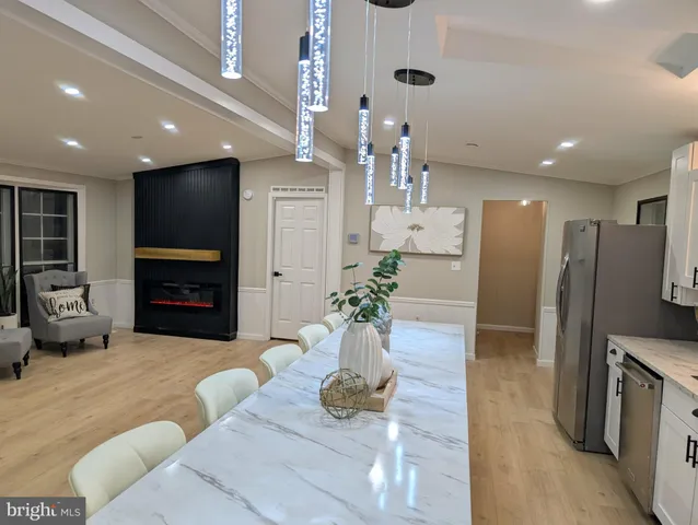 a lobby with furniture and a fireplace