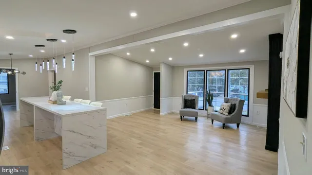 a lobby with furniture and floor to ceiling window