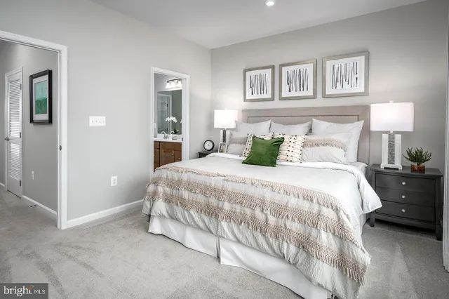 a bedroom with a bed and a lamp