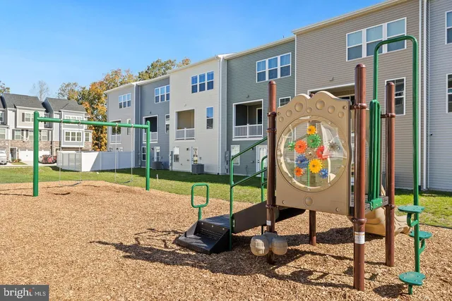 a view of a lounge chairs in front of building