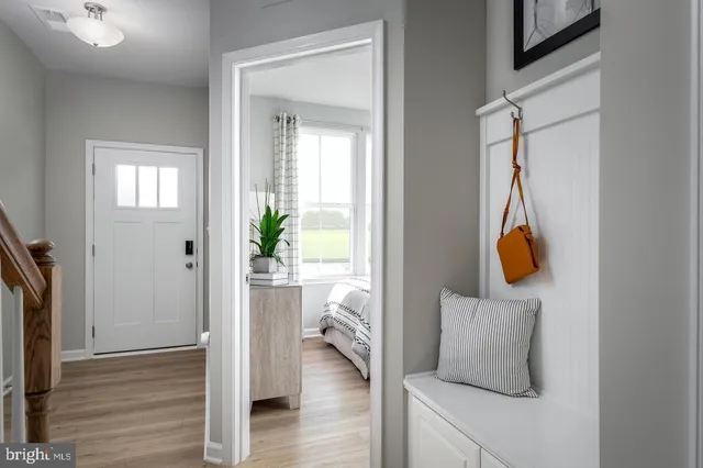 a room that has a bed and a window in it