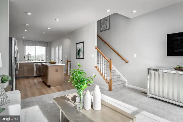 a lobby with furniture and a potted plant