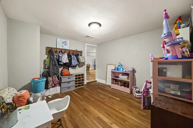 a bedroom with furniture and a bed