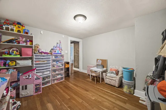 a room with furniture and a wooden floor