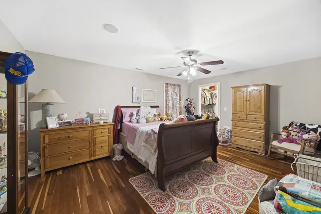 a bed room with a bed and a chandelier
