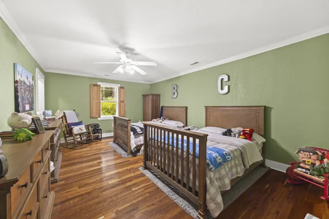 a bedroom with furniture and a window