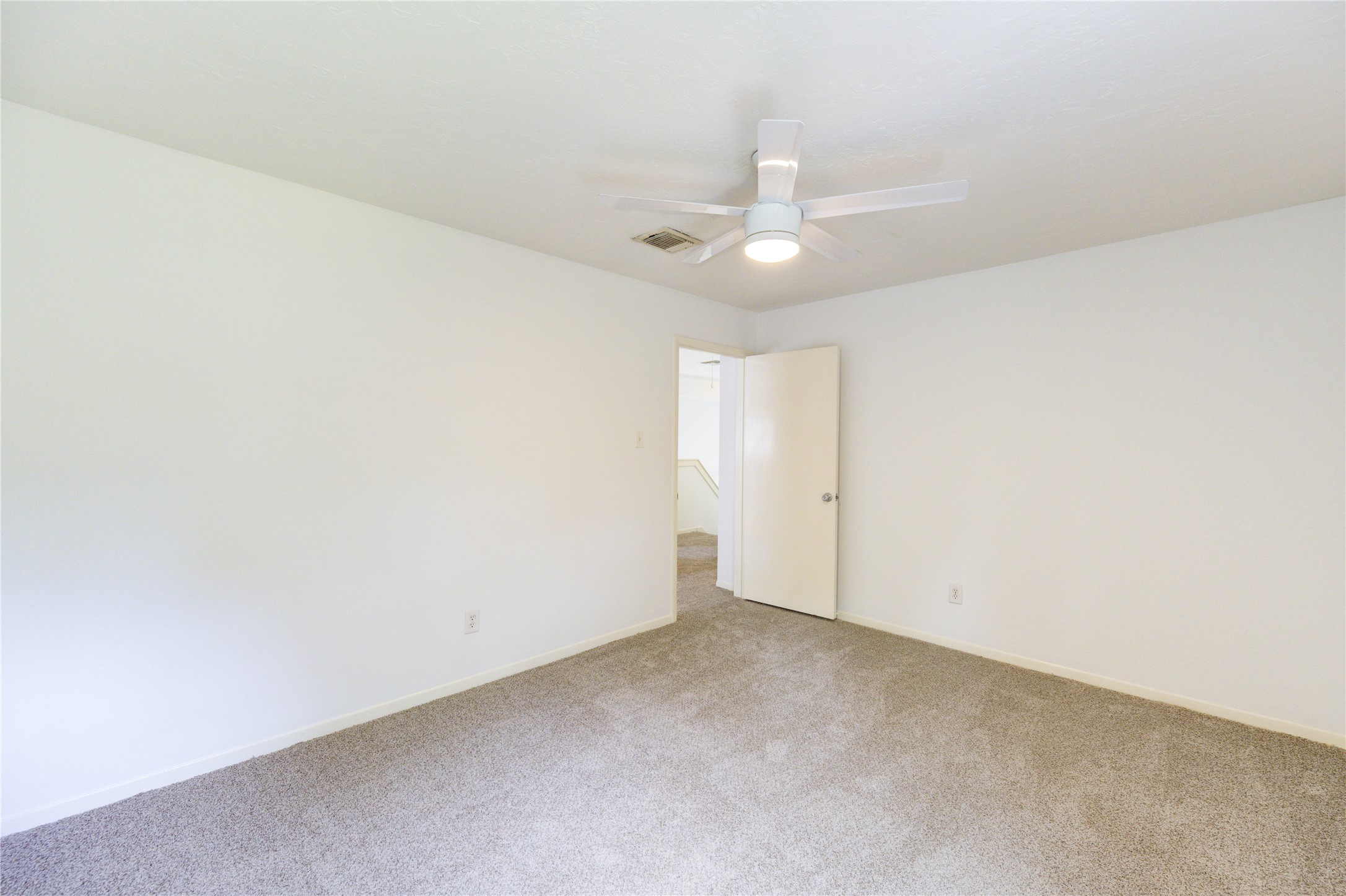 3639 Fir Forest Drive Spring, TX 77388 - Photo 36 of 44 an empty room with a ceiling fan and wooden floor