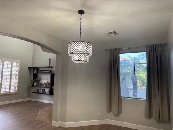 a kitchen with stainless steel appliances granite countertop a refrigerator and a stove