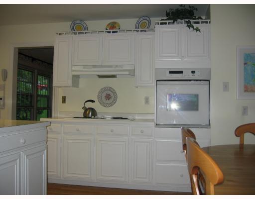140 Witherow Road Bell Acres, PA 15143 - Photo 7 of 8 Kitchen. The cooktop and oven area of the kitchen balances two other walls of cabinetry and appliances. The laundry room is tucked away between the kitchen and family room. The house has good storage areas and a large basement waiting for your touch and use.