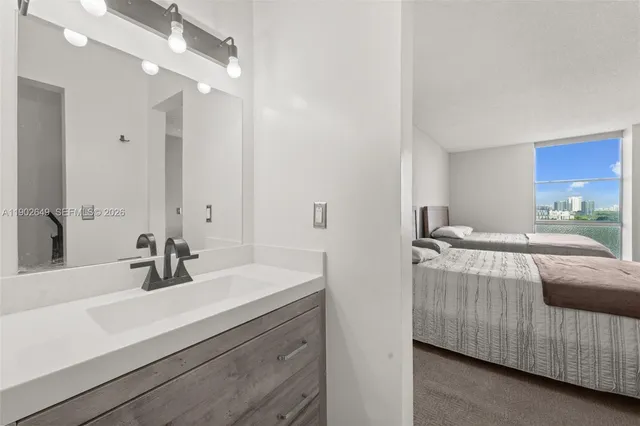 a bathroom with a sink double vanity and a mirror