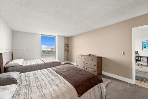 a bedroom with a bed and a closet