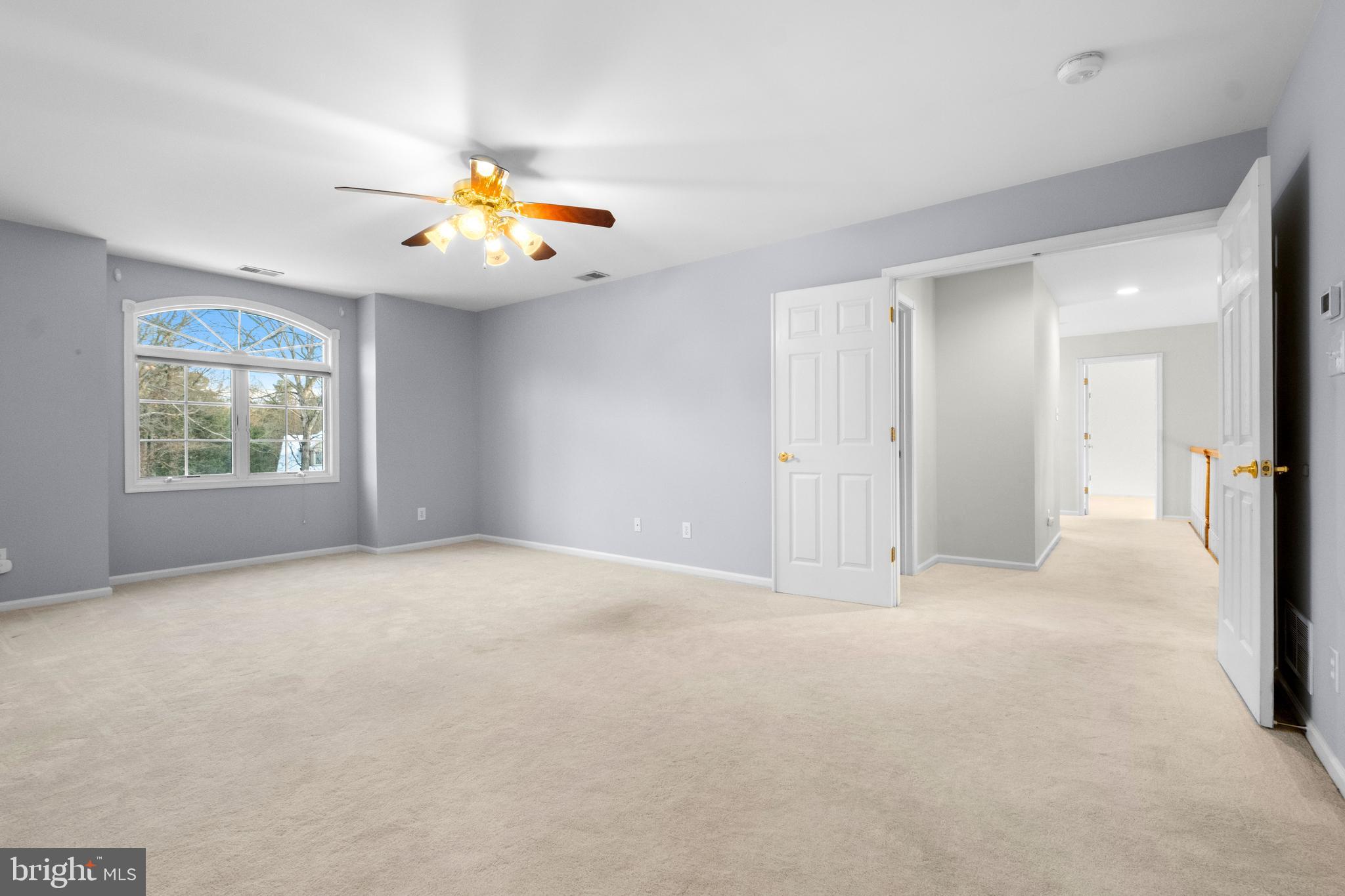 1 Braddocks Mill Road Medford, NJ 08055 - Photo 29 of 61 an empty room with windows and a chandelier fan