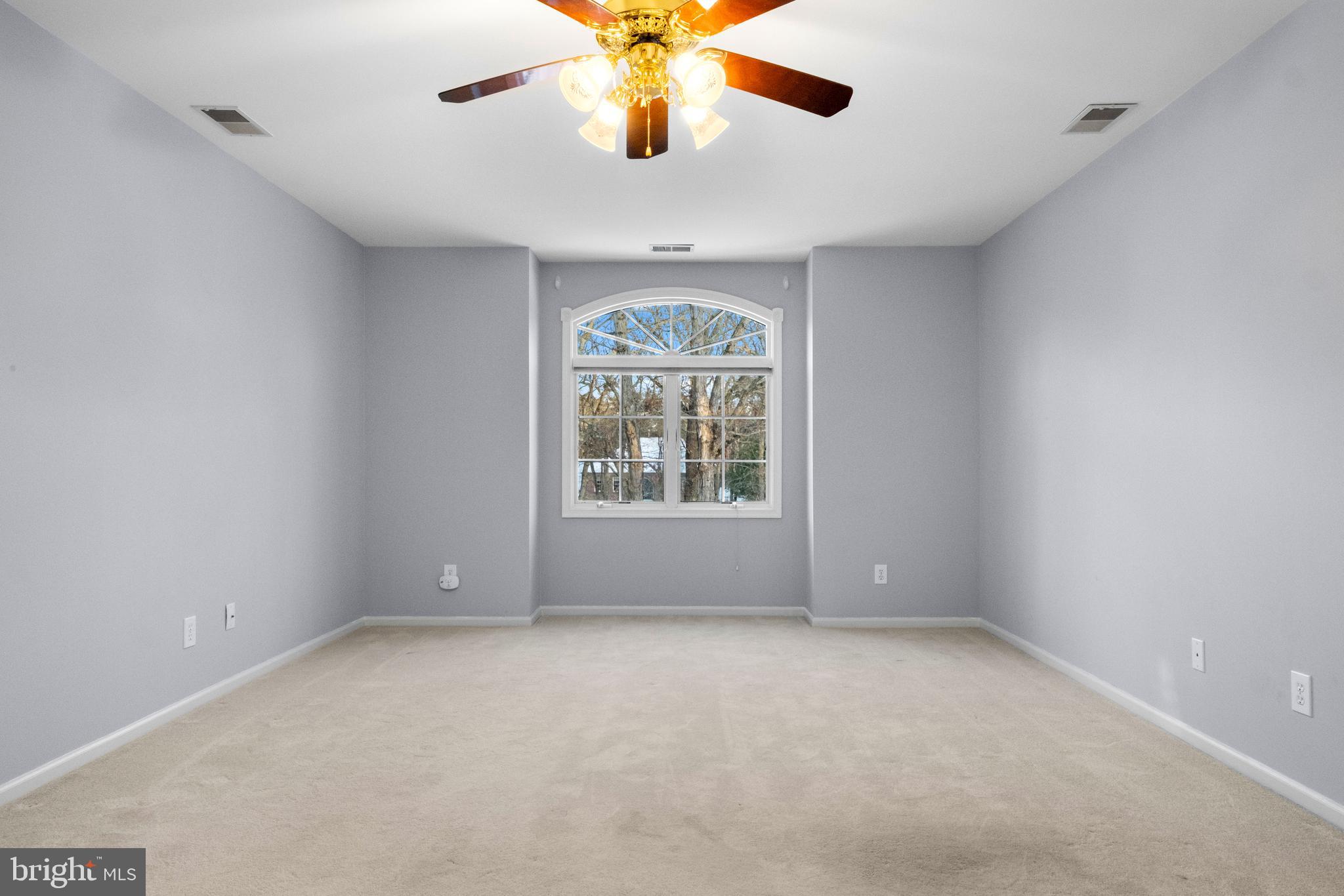 1 Braddocks Mill Road Medford, NJ 08055 - Photo 31 of 61 a view of an empty room with window and chandelier fan