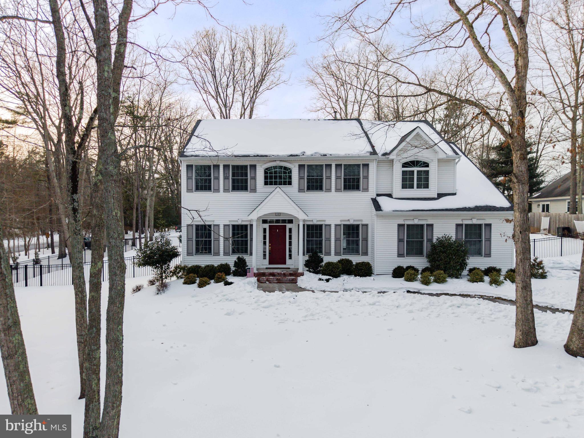 1 Braddocks Mill Road Medford, NJ 08055 - Photo 53 of 61 a view of a white house with a yard covered in snow