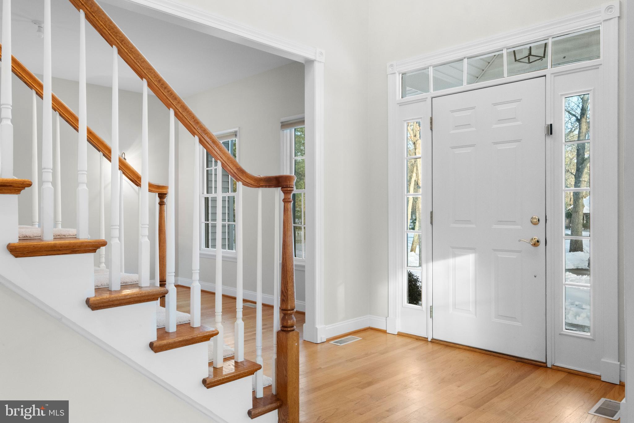 1 Braddocks Mill Road Medford, NJ 08055 - Photo 7 of 61 a view of an entryway with wooden floor and door