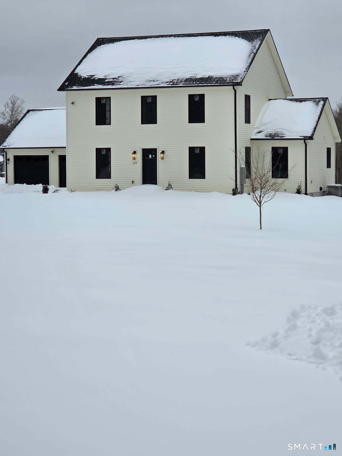 a view of house with yard