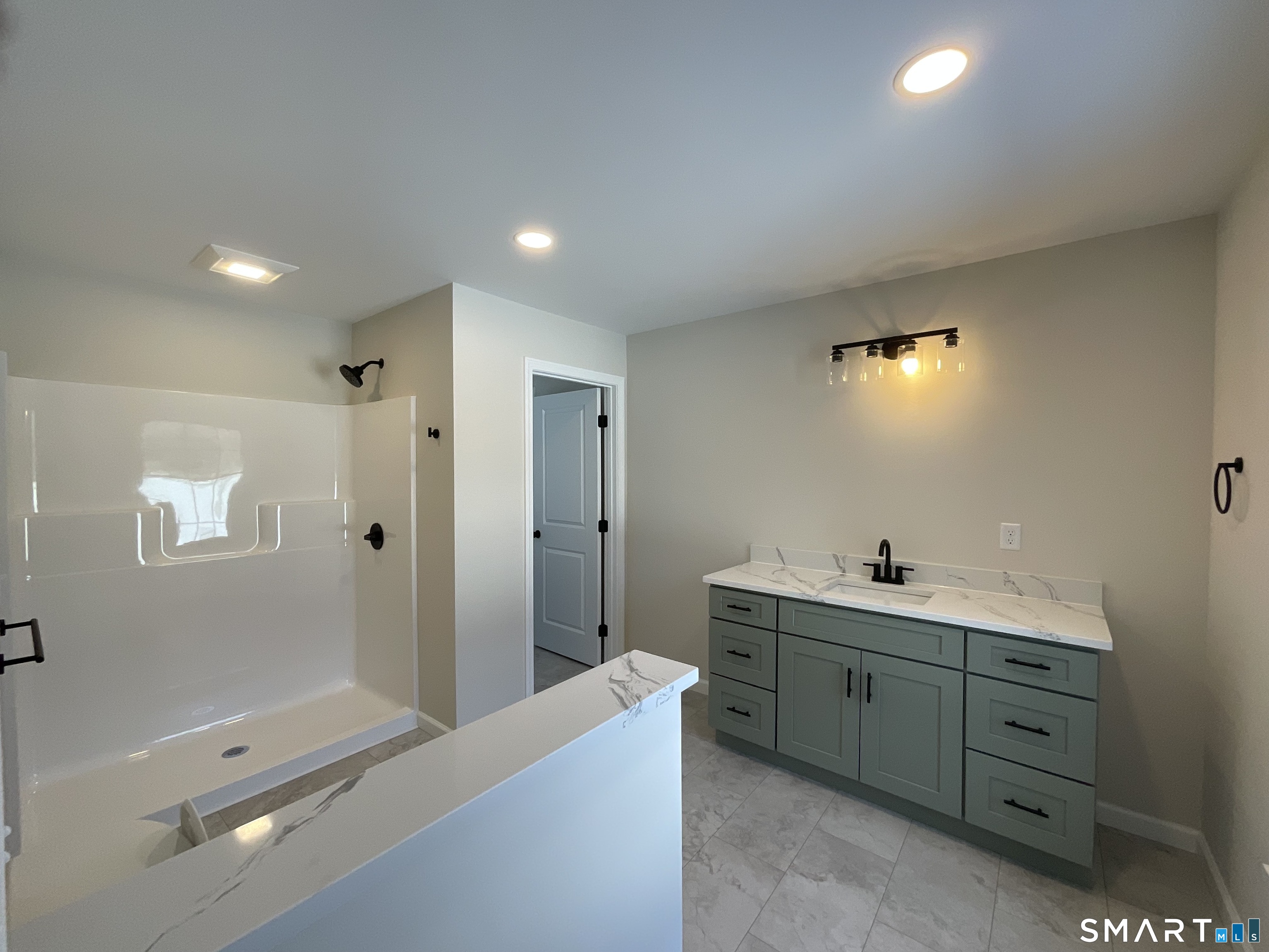 277 Moosup Pond Road Plainfield, CT 06354 - Photo 13 of 25 a bathroom with a double vanity sink toilet and shower