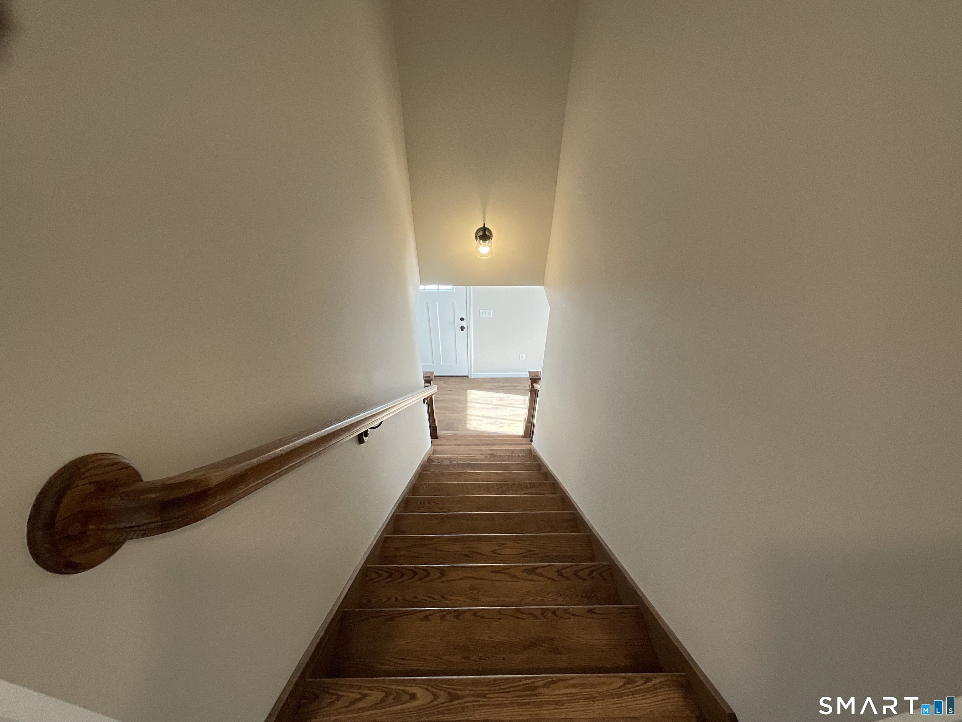 277 Moosup Pond Road Plainfield, CT 06354 - Photo 15 of 25 a view of a hallway with wooden floor and staircase