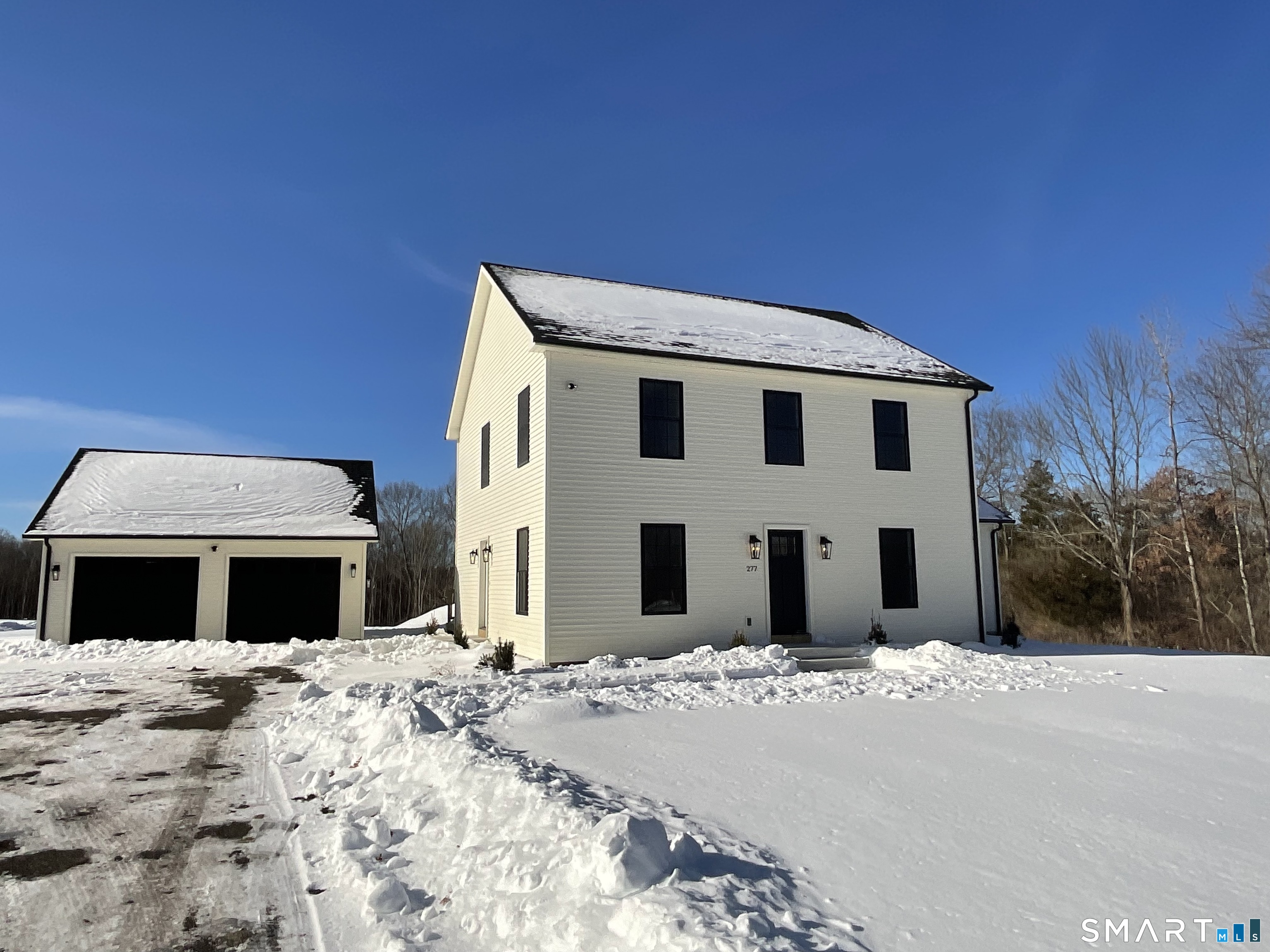 277 Moosup Pond Road Plainfield, CT 06354 - Photo 2 of 25 a front view of a house with a yard