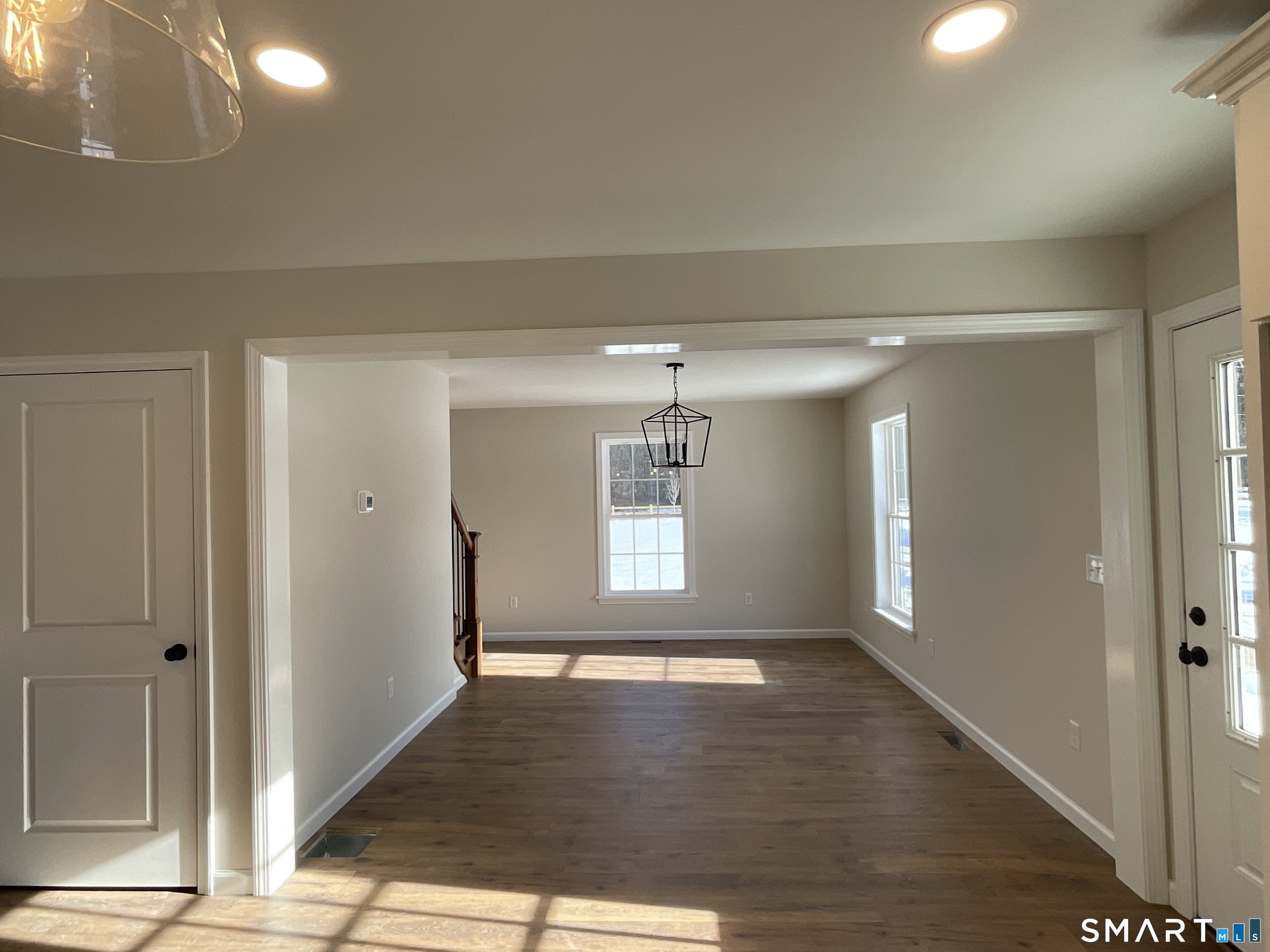277 Moosup Pond Road Plainfield, CT 06354 - Photo 5 of 25 a view of empty room with wooden floor and fan