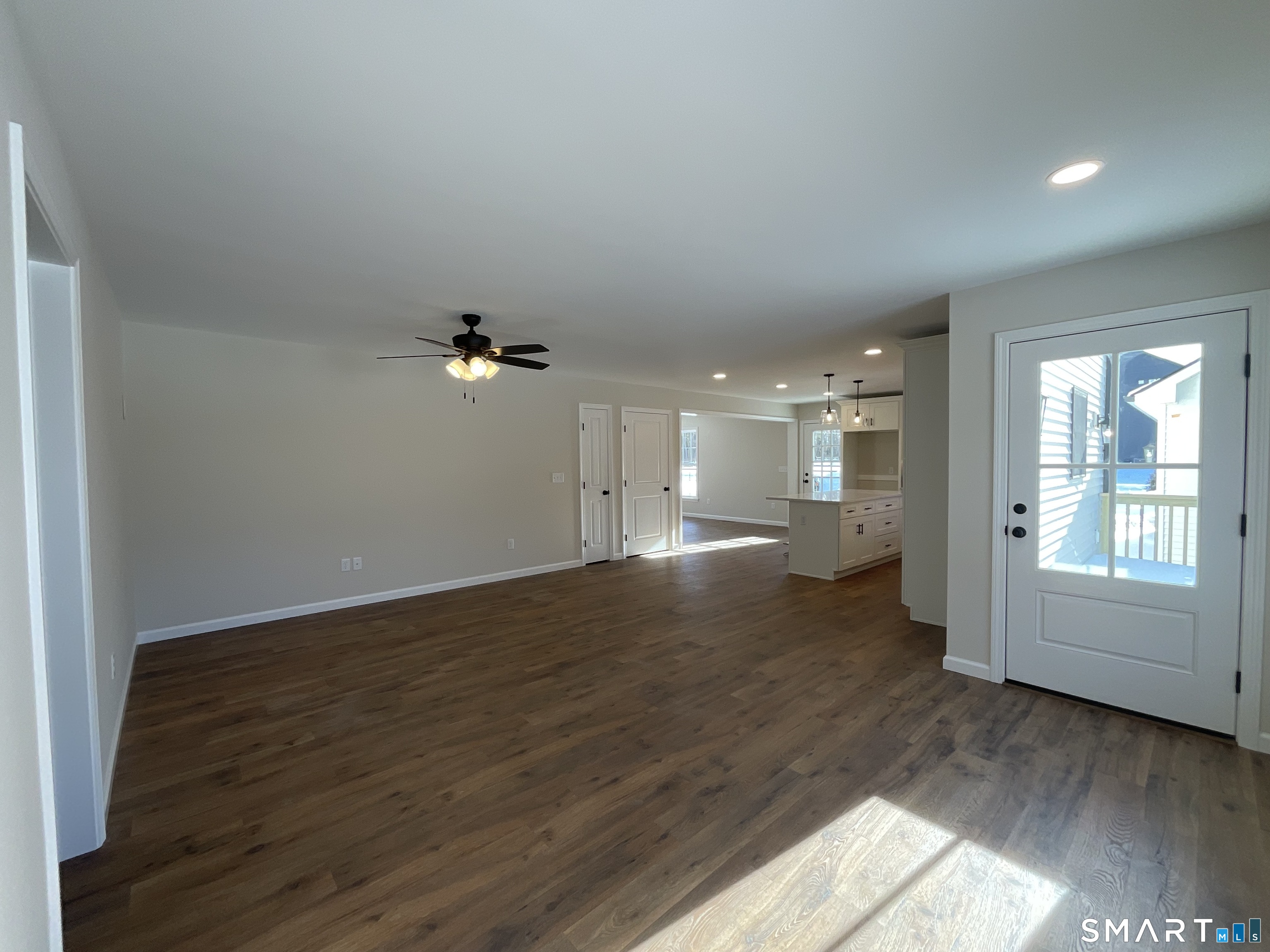 277 Moosup Pond Road Plainfield, CT 06354 - Photo 7 of 25 wooden floor in an empty room with a window