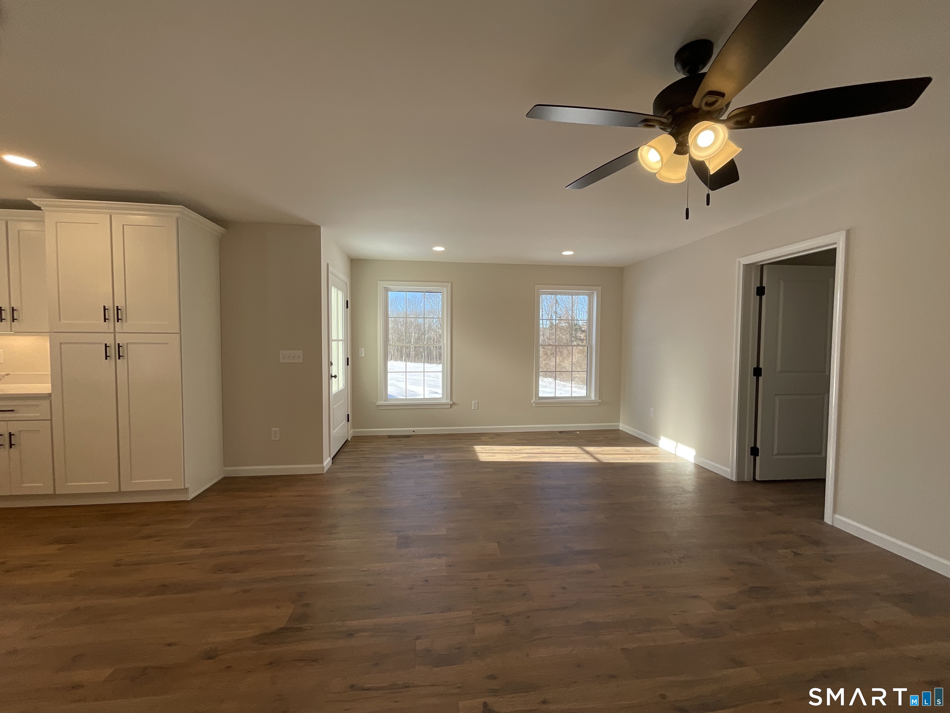 277 Moosup Pond Road Plainfield, CT 06354 - Photo 8 of 25 a view of an empty room with window and wooden floor