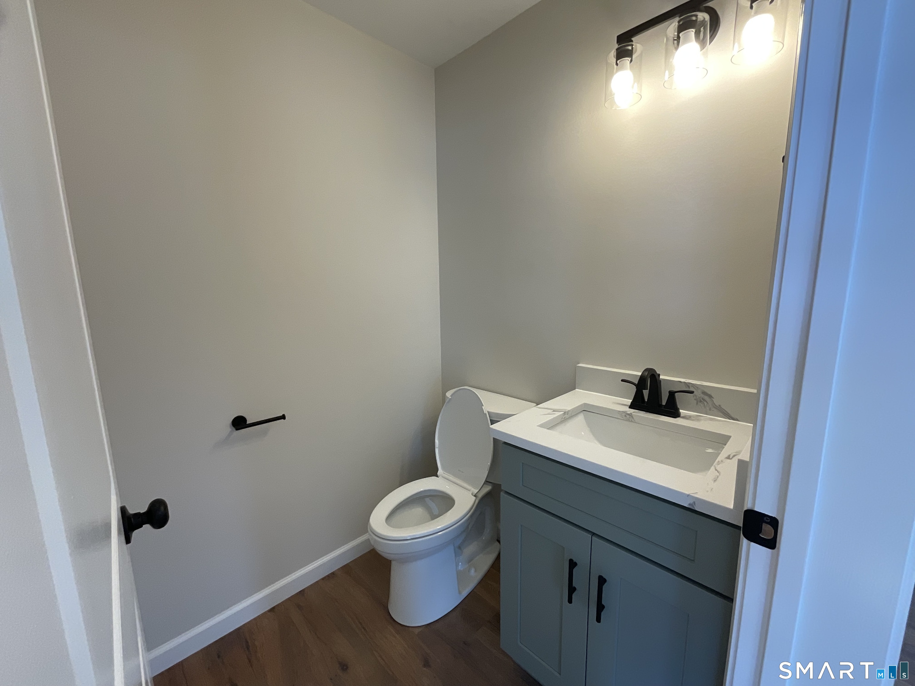 277 Moosup Pond Road Plainfield, CT 06354 - Photo 9 of 25 a bathroom with a toilet sink and mirror