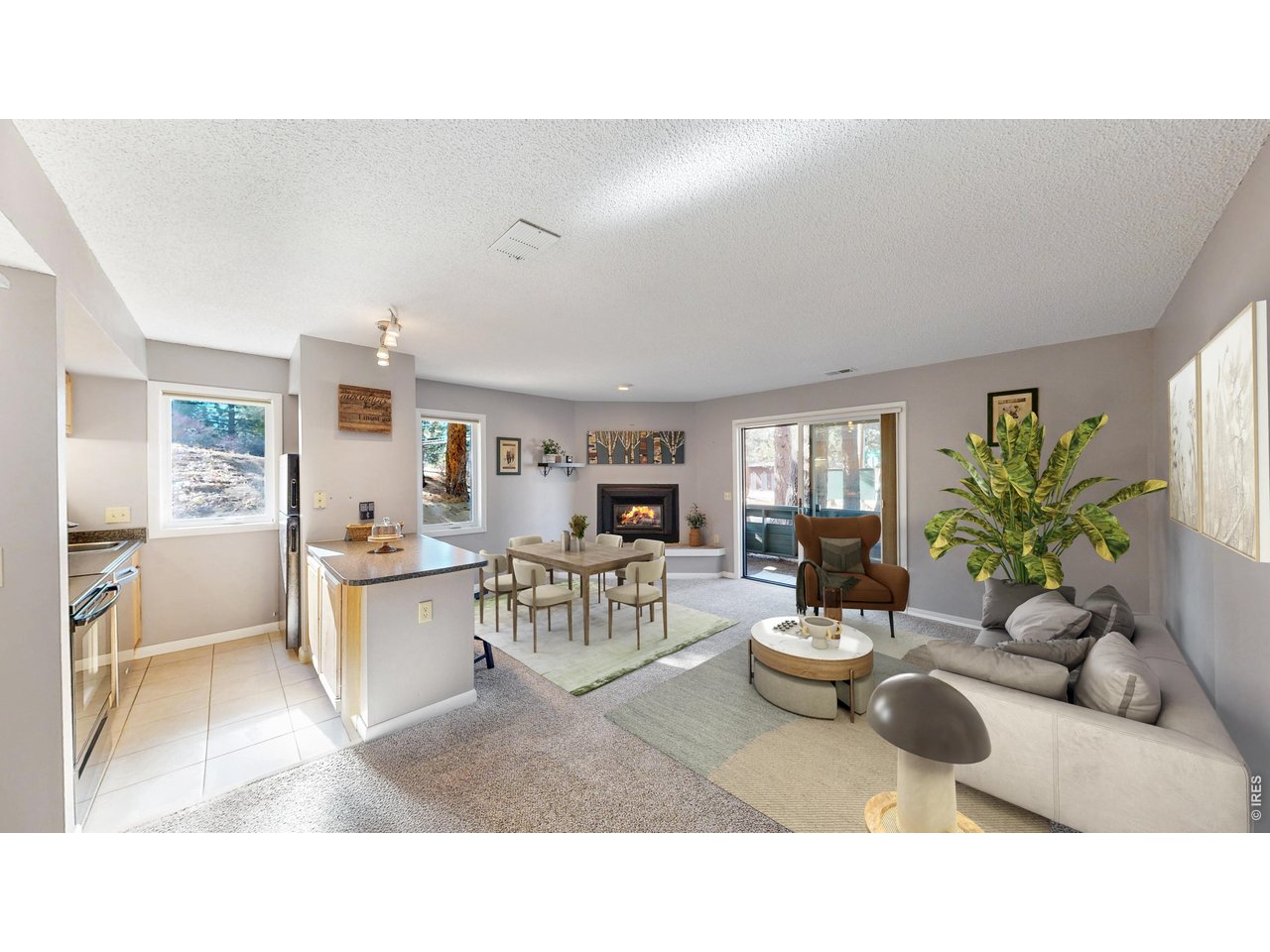 200 Riverside Drive, Unit 1 Estes Park, CO 80517 - Photo 1 of 27 a living room with furniture and a large window