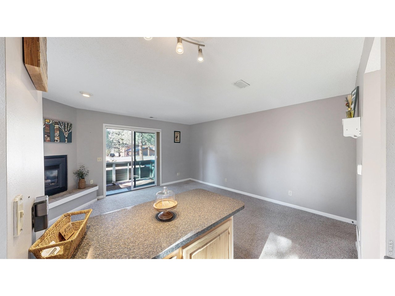 200 Riverside Drive, Unit 1 Estes Park, CO 80517 - Photo 10 of 27 a living room with furniture and window