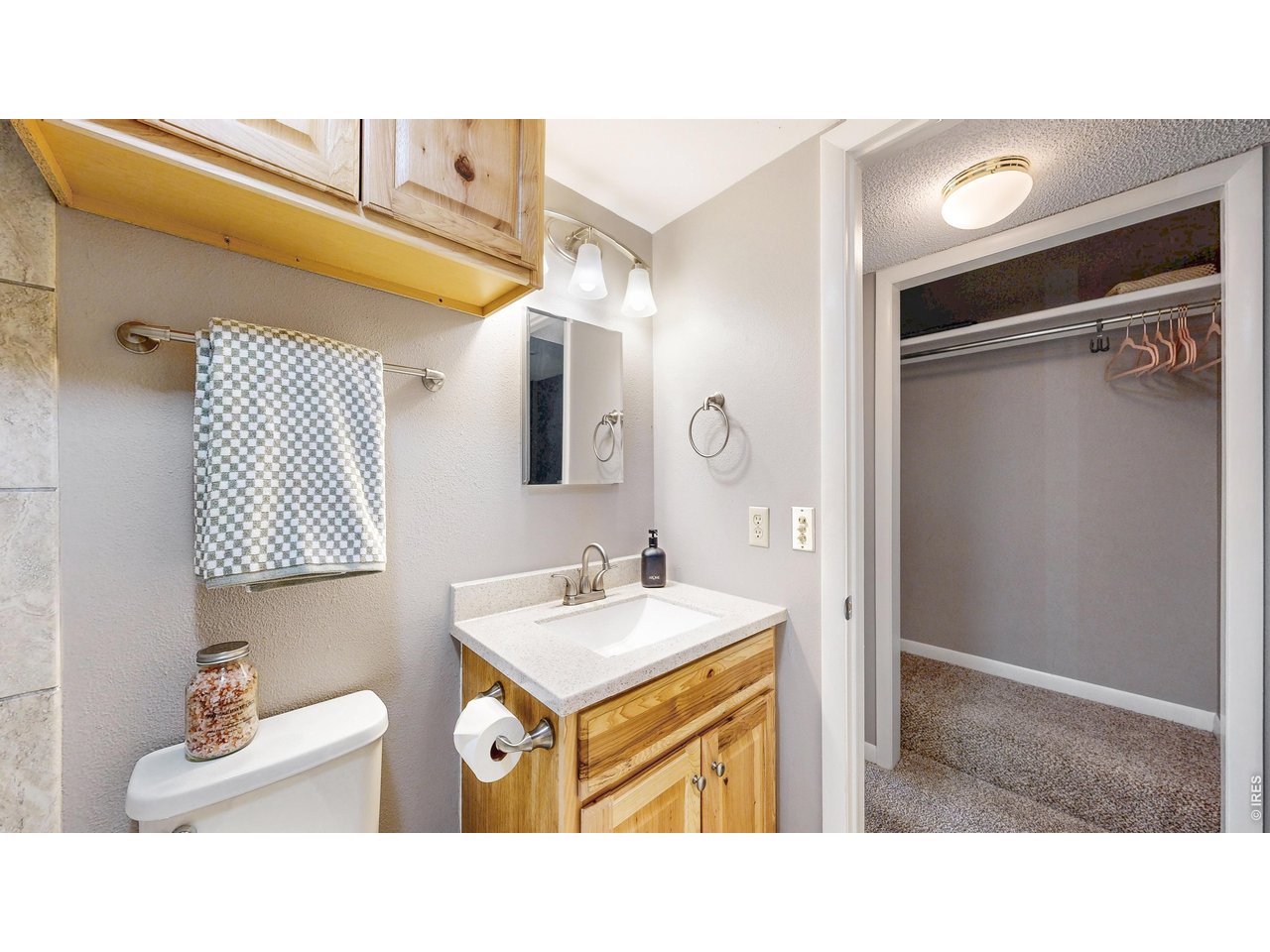200 Riverside Drive, Unit 1 Estes Park, CO 80517 - Photo 15 of 27 a bathroom with a sink a mirror and a shower