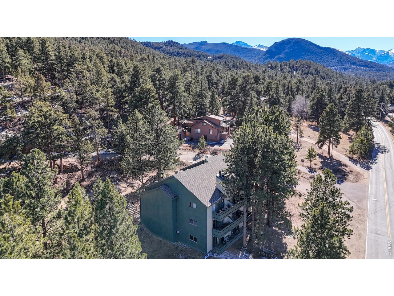 200 Riverside Drive, Unit 1 Estes Park, CO 80517 - Photo 25 of 27 a aerial view of a house with a mountain in the background