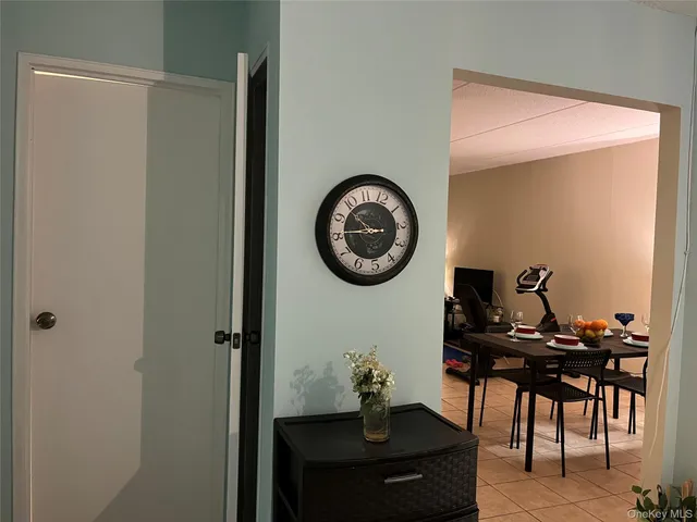 a view of a room with a table and chairs