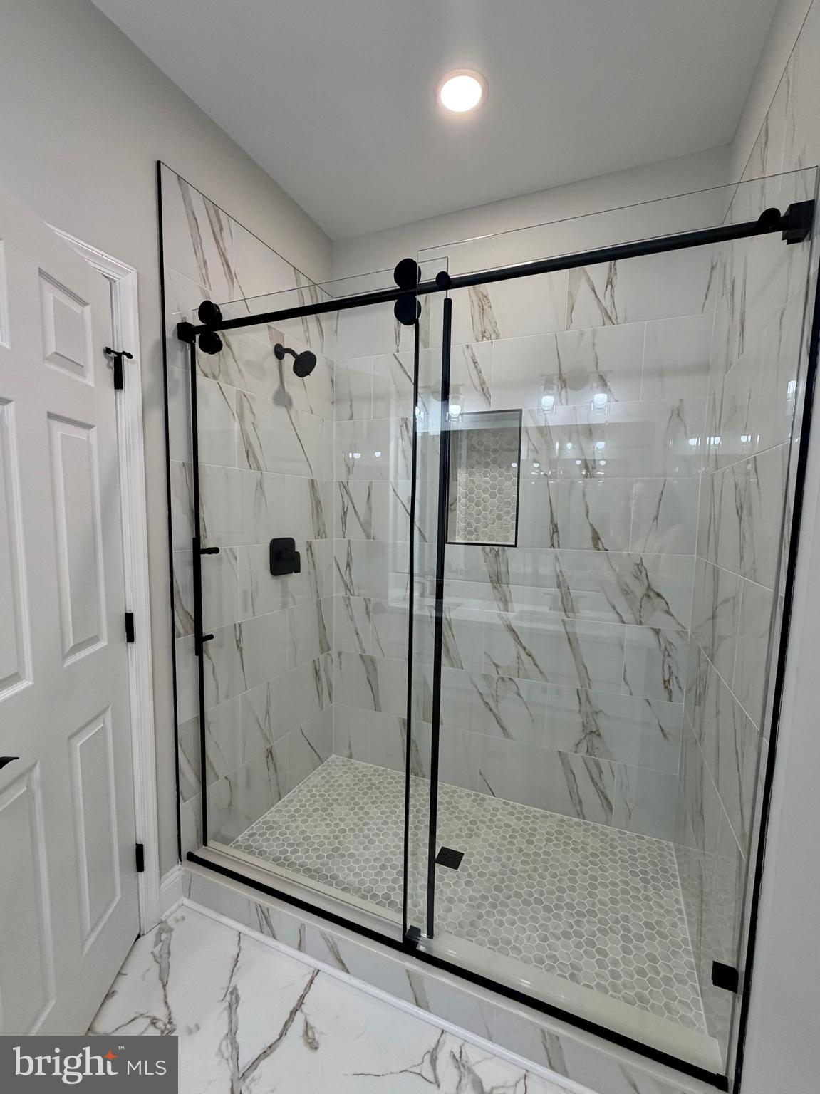 44968 Hewitt Road Callaway, MD 20620 - Photo 11 of 33 a bathroom with a glass shower door
