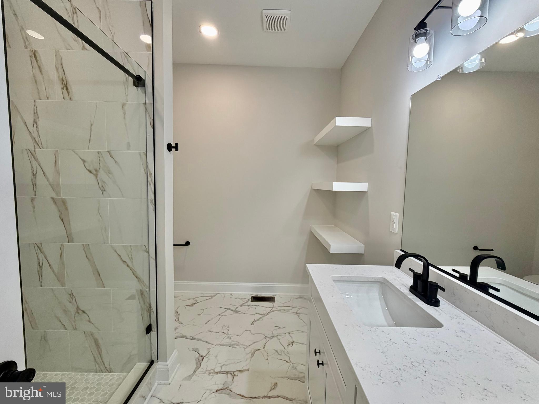 44968 Hewitt Road Callaway, MD 20620 - Photo 13 of 33 a bathroom with a sink a toilet and shower