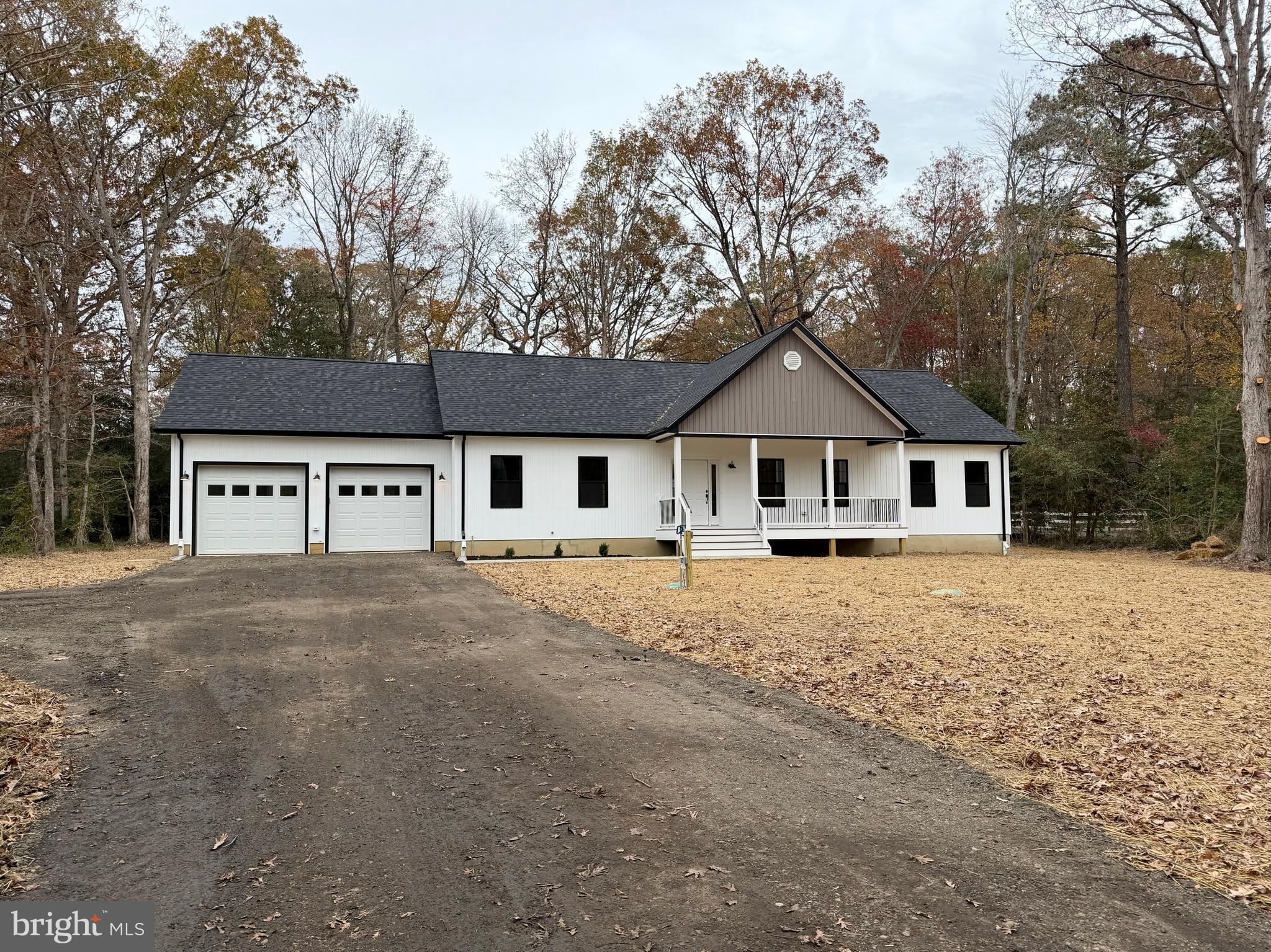 44968 Hewitt Road Callaway, MD 20620 - Photo 28 of 33 a front view of a house with a dirt yard and trees