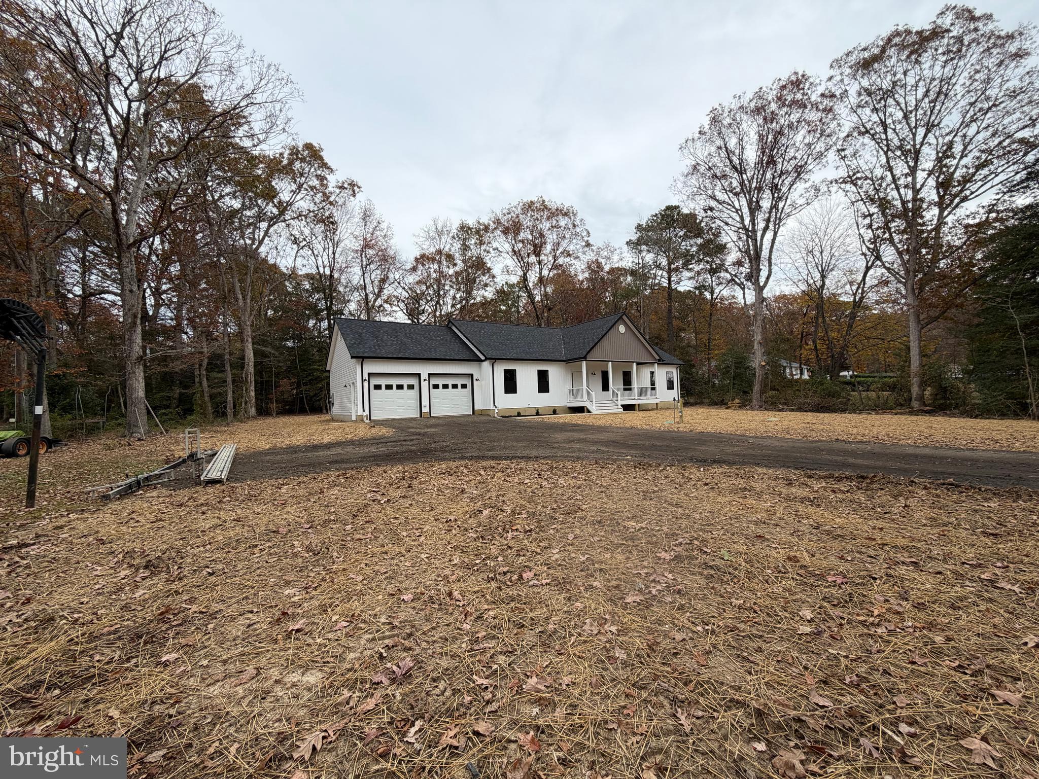 44968 Hewitt Road Callaway, MD 20620 - Photo 32 of 33 a house with trees in the background