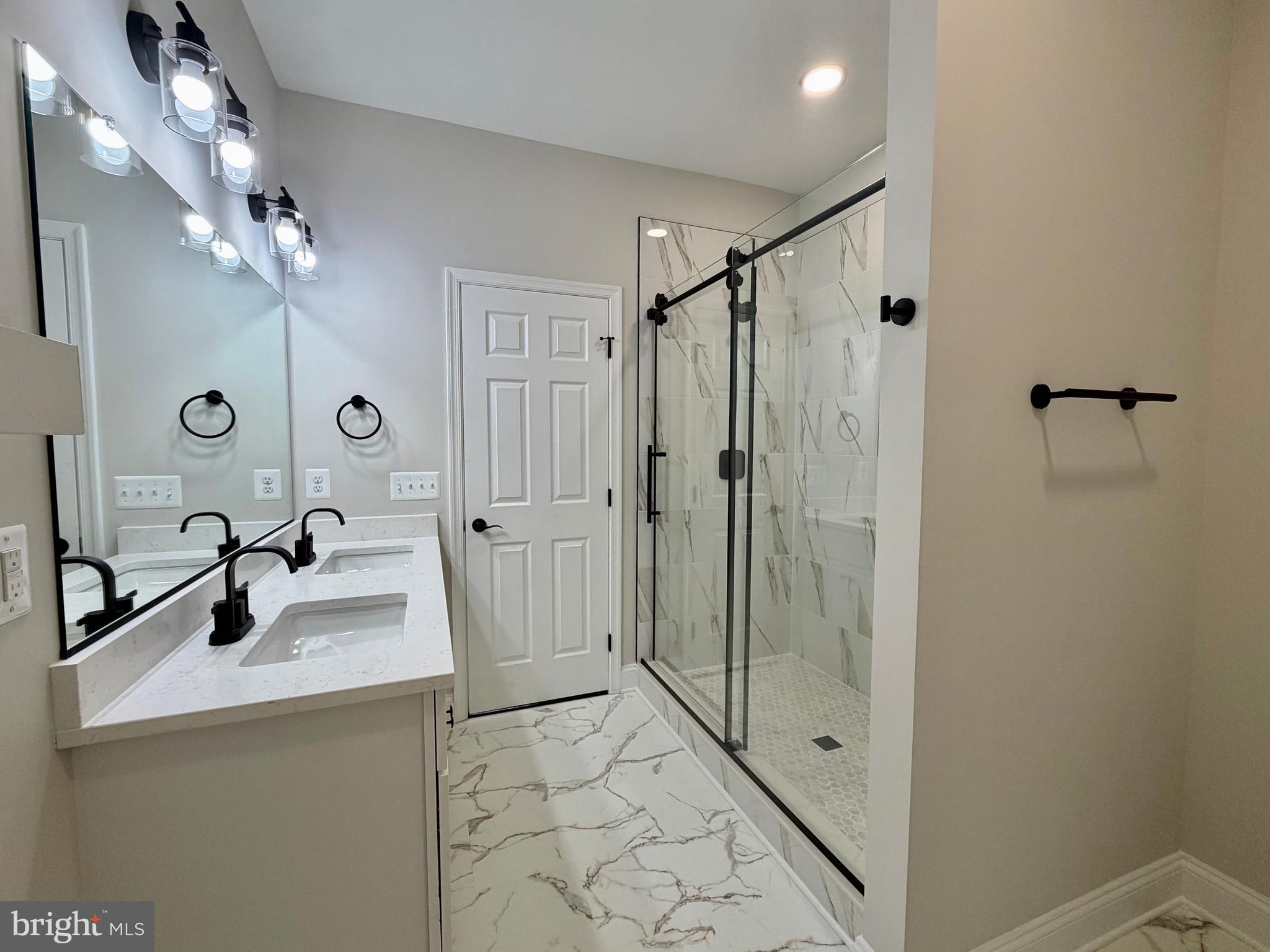 44968 Hewitt Road Callaway, MD 20620 - Photo 10 of 33 a bathroom with a sink a toilet a mirror and shower