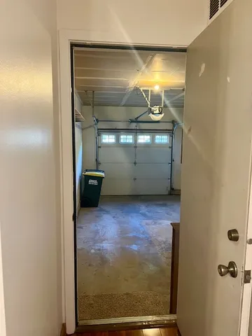 a view of a hallway with a room