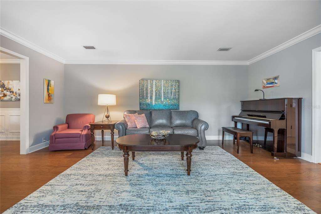 5808 Southwest 35th Way Gainesville, FL 32608 - Photo 11 of 54 a living room with furniture and a wooden floor