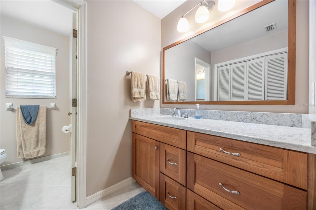 5808 Southwest 35th Way Gainesville, FL 32608 - Photo 25 of 54 a bathroom with a sink and a mirror