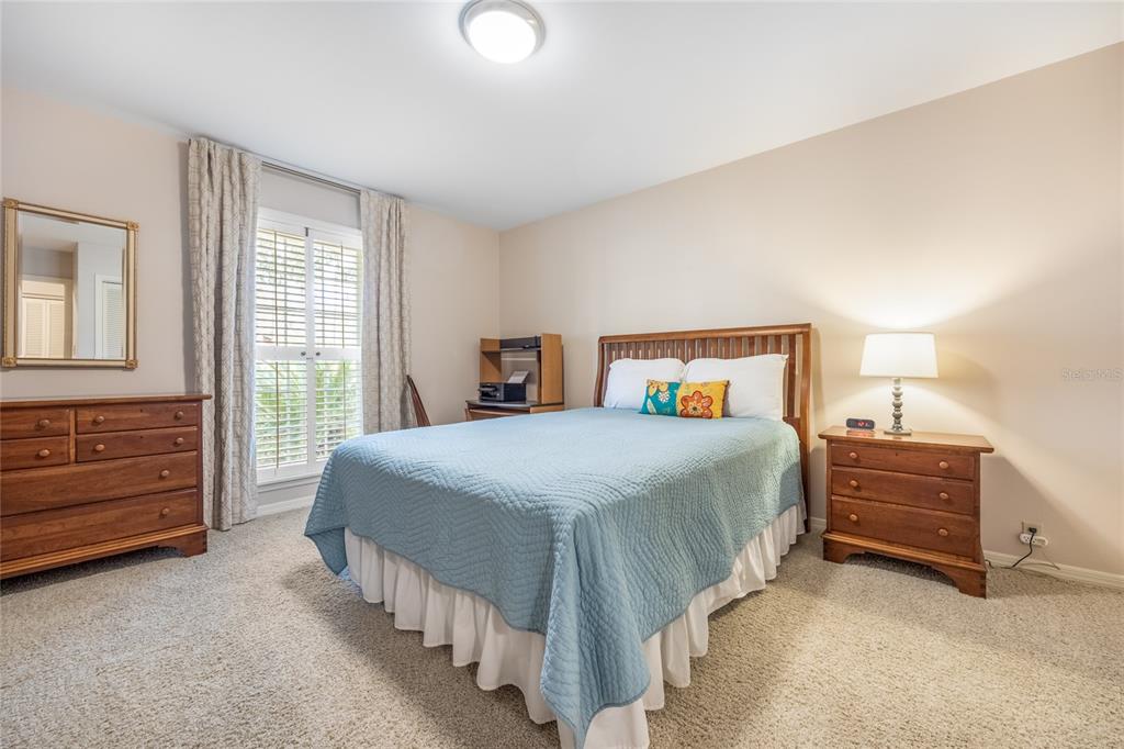 5808 Southwest 35th Way Gainesville, FL 32608 - Photo 29 of 54 a bedroom with a bed and a dresser