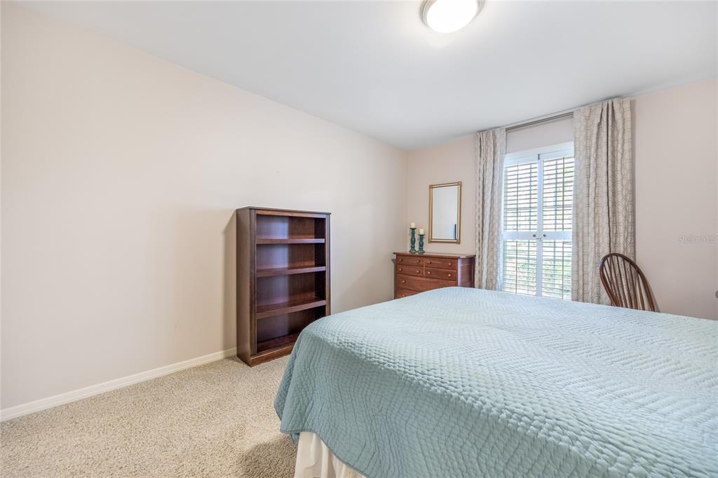 5808 Southwest 35th Way Gainesville, FL 32608 - Photo 30 of 54 a bedroom with a bed and a window