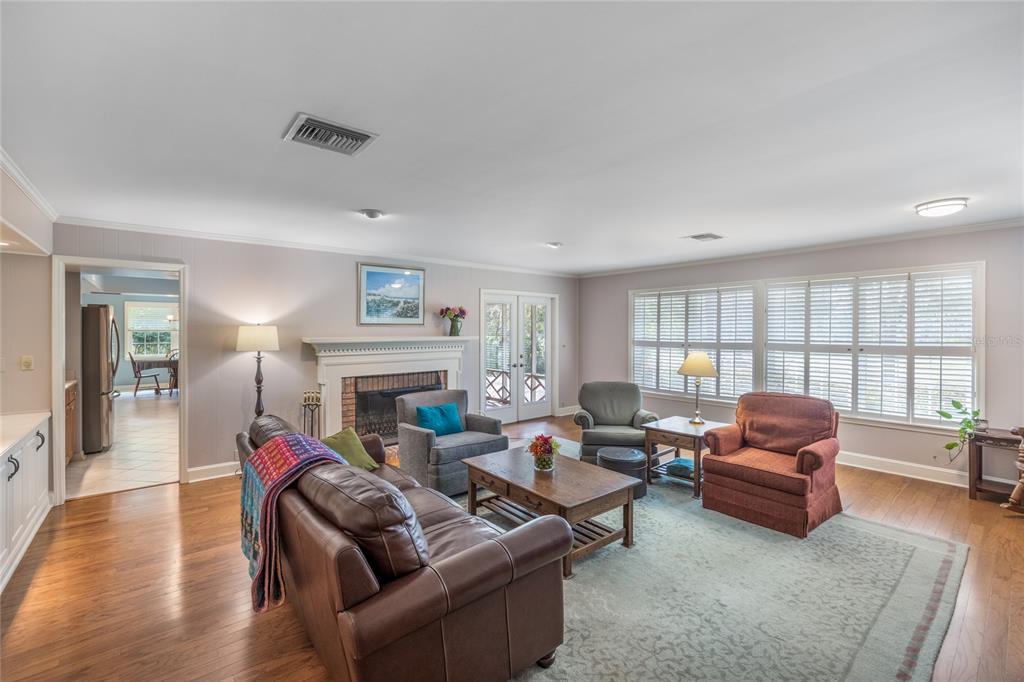 5808 Southwest 35th Way Gainesville, FL 32608 - Photo 3 of 54 a living room with furniture a fireplace and a potted plant