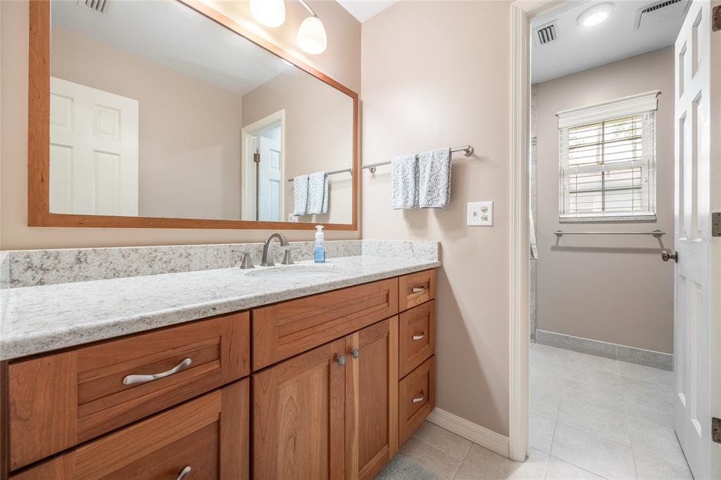 5808 Southwest 35th Way Gainesville, FL 32608 - Photo 33 of 54 a bathroom with a sink and a mirror