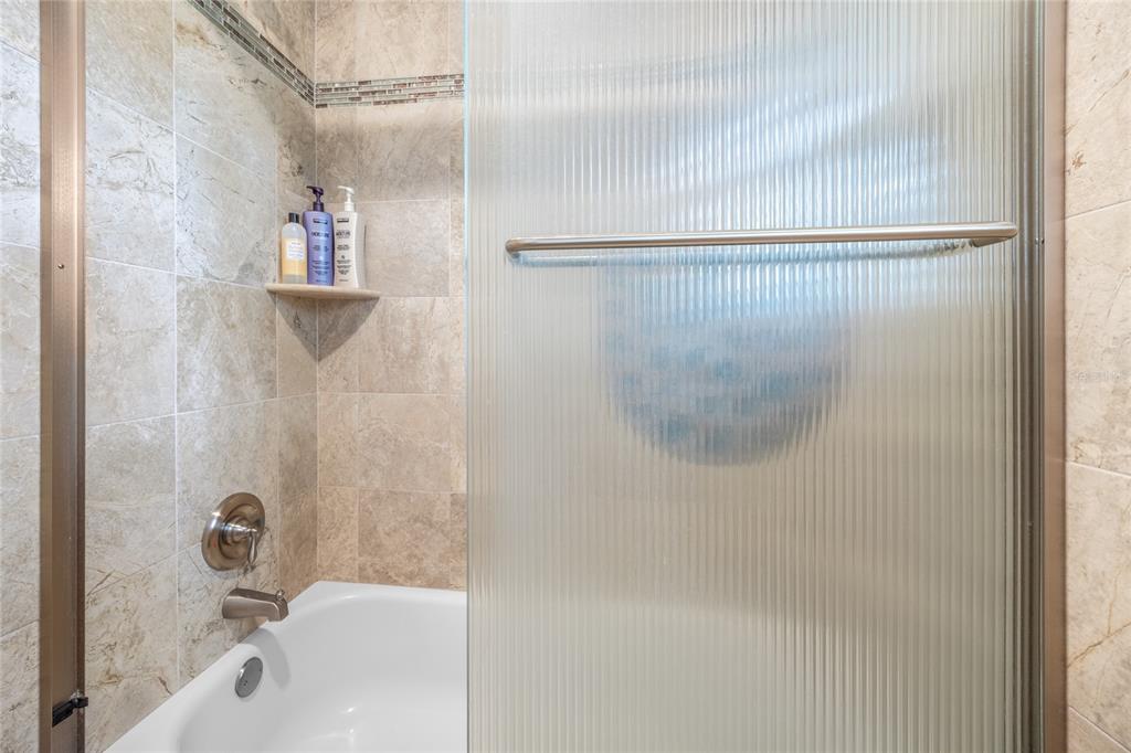 5808 Southwest 35th Way Gainesville, FL 32608 - Photo 35 of 54 a bathroom with a shower and a bath tub