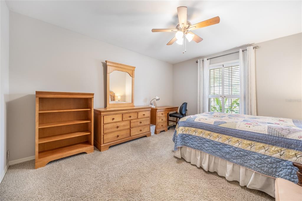5808 Southwest 35th Way Gainesville, FL 32608 - Photo 37 of 54 a bedroom with a bed dresser and a window