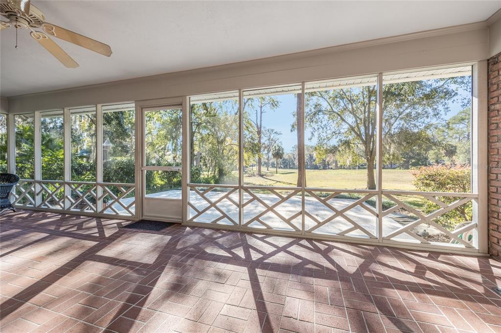 5808 Southwest 35th Way Gainesville, FL 32608 - Photo 42 of 54 a living room filled with furniture and large windows