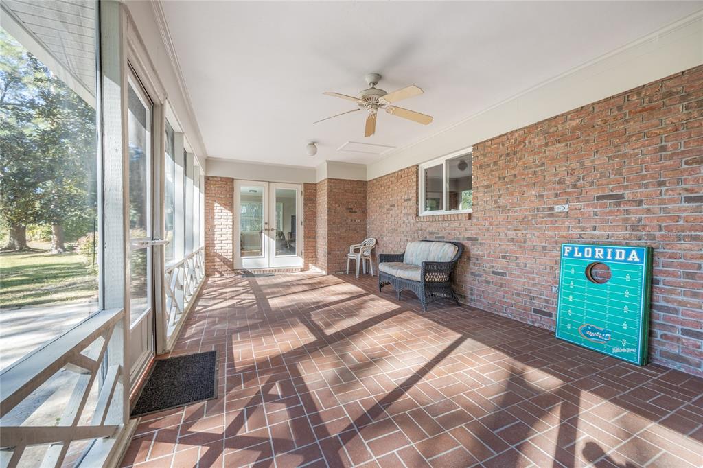 5808 Southwest 35th Way Gainesville, FL 32608 - Photo 44 of 54 a bedroom with a bed and a window